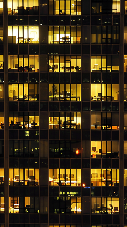 Chitrmela an office building at night with windows in the window a4f7e364 6c84 47c8 b616 2a0aa75c5403 0